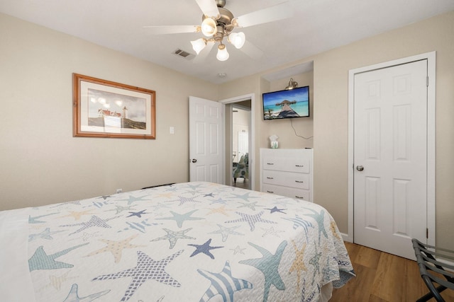 bedroom featuring ceiling fan and wood-type flooring