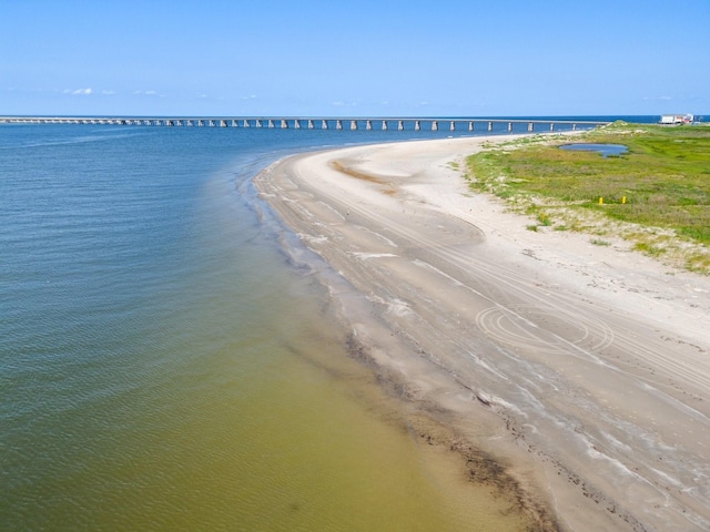 drone / aerial view featuring a view of the beach and a water view