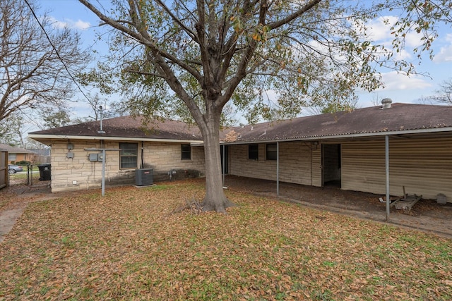 back of property with central AC unit