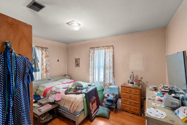 bedroom featuring hardwood / wood-style flooring