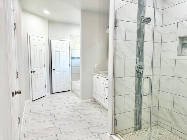 bathroom featuring vanity and plus walk in shower