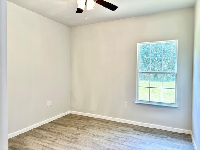 unfurnished room featuring hardwood / wood-style flooring and ceiling fan