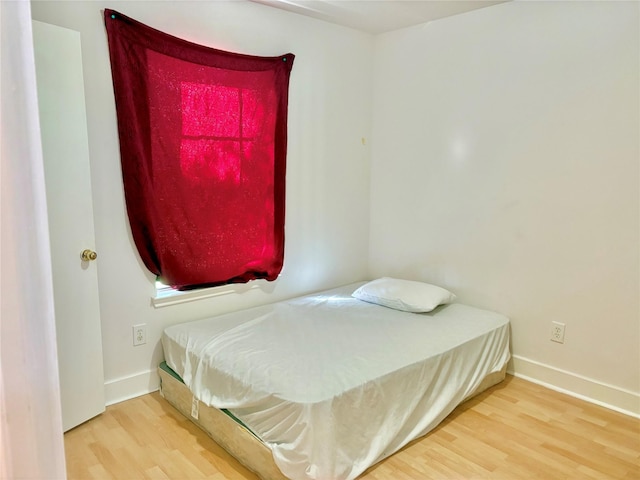 bedroom featuring hardwood / wood-style floors