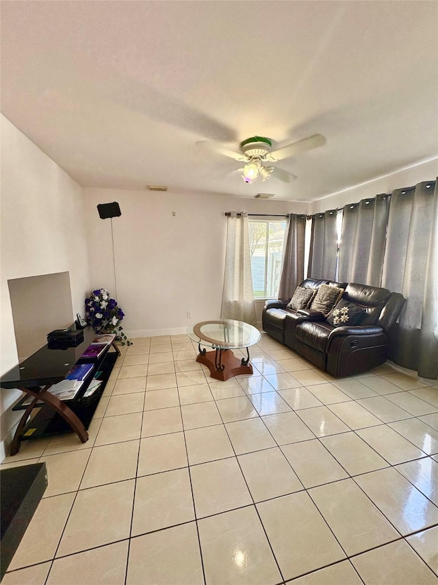 living room with light tile patterned floors and ceiling fan