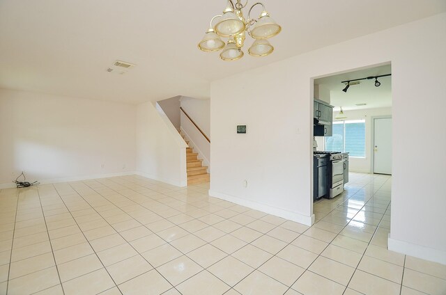 3802 E Traditions Ct, Houston, TX 77082 - spare room with light tile patterned floors, a chandelier, stairs, rail lighting, and baseboards