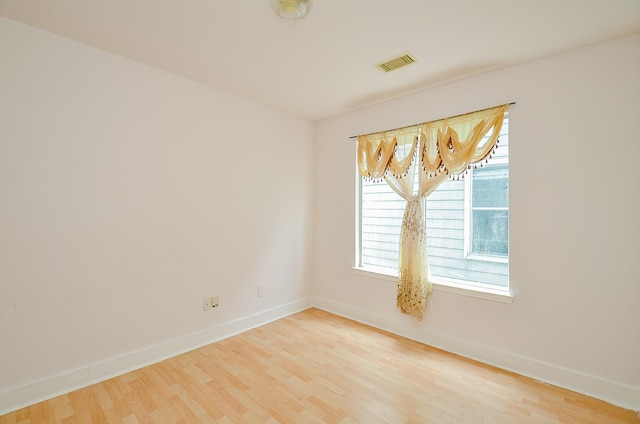 3802 E Traditions Ct, Houston, TX 77082 - empty room featuring wood finished floors, plenty of natural light, and baseboards