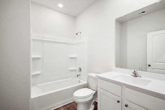 full bathroom with shower / bathtub combination, vanity, toilet, and hardwood / wood-style floors