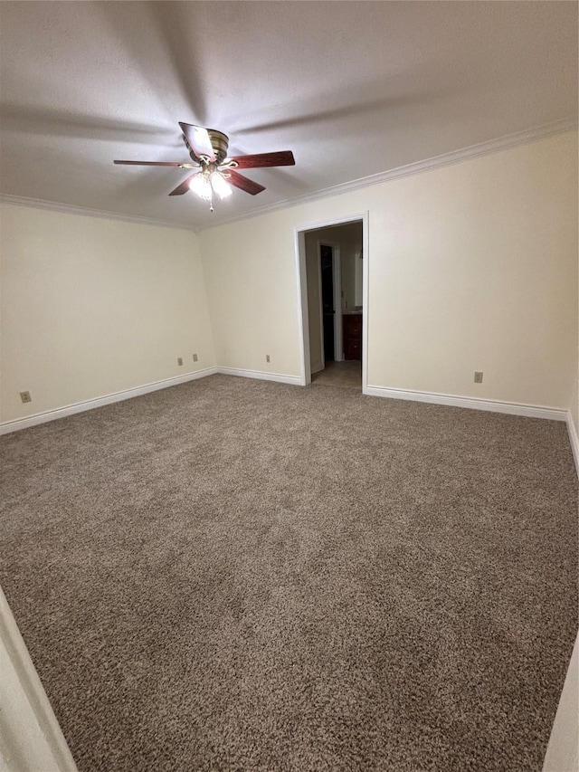 empty room with crown molding, ceiling fan, and carpet flooring