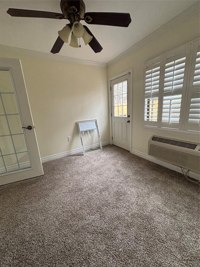 empty room featuring carpet floors, ornamental molding, and an AC wall unit