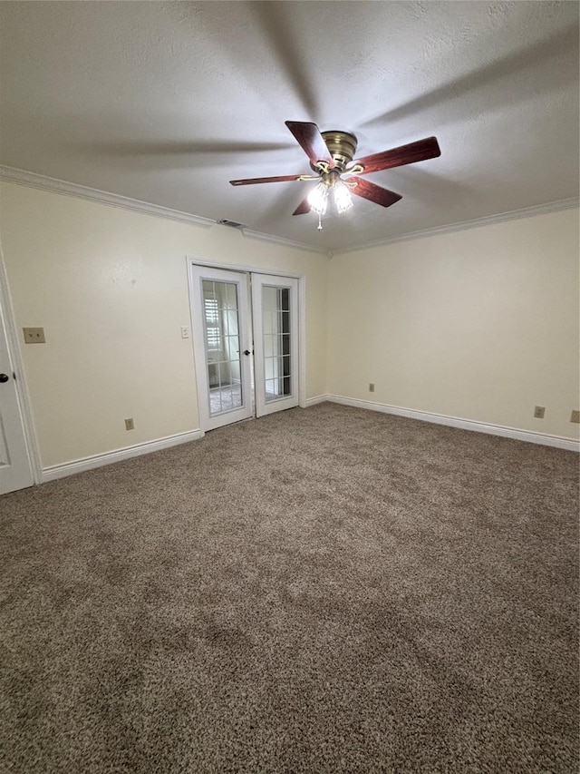 carpeted spare room featuring french doors, ceiling fan, ornamental molding, and a textured ceiling