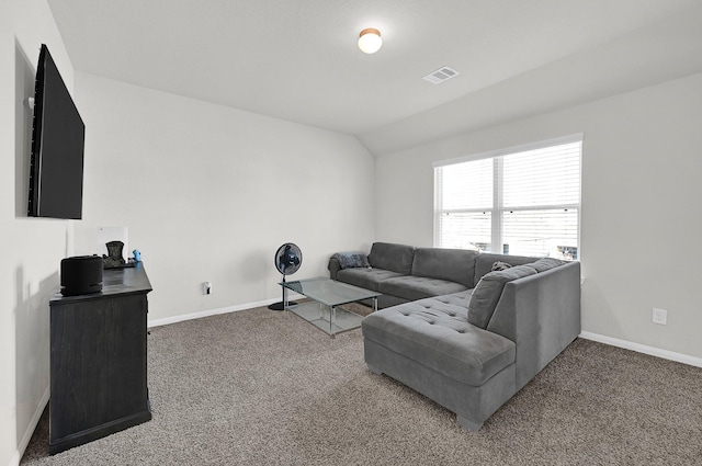 carpeted living room featuring lofted ceiling