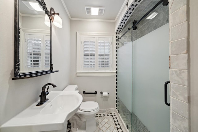 bathroom with sink, ornamental molding, a shower with shower door, tile patterned floors, and toilet