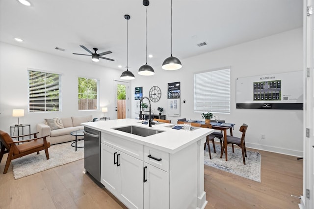 324 Neyland St, Houston, TX 77022 - kitchen featuring a sink, stainless steel dishwasher, light wood finished floors, ceiling fan, and recessed lighting