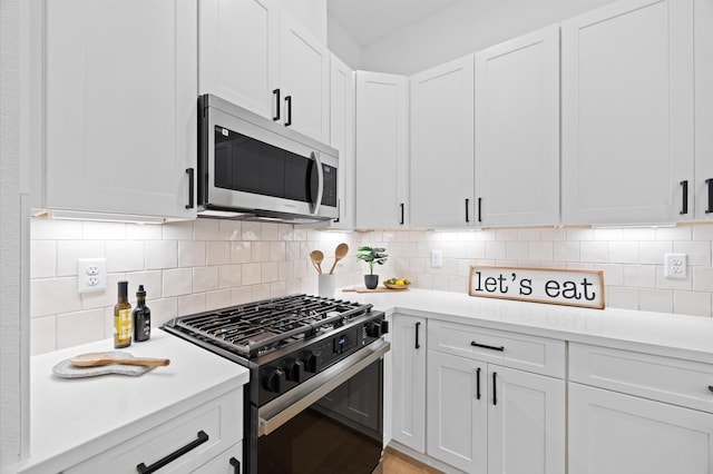324 Neyland St, Houston, TX 77022 - kitchen with stainless steel appliances, light countertops, white cabinets, and backsplash