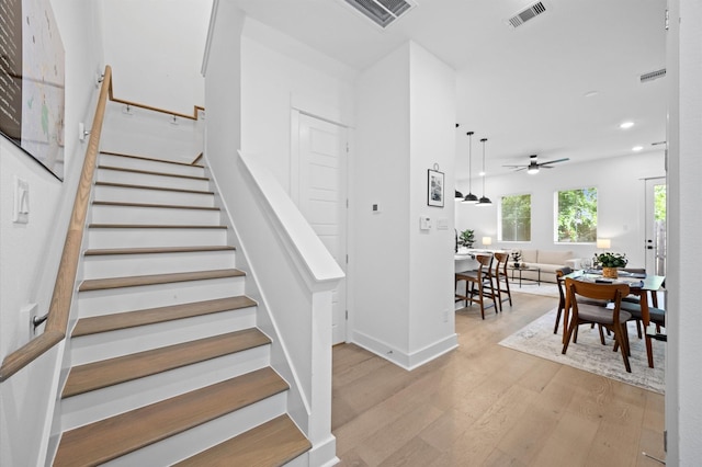 324 Neyland St, Houston, TX 77022 - stairs featuring wood finished floors, recessed lighting, a ceiling fan, and baseboards