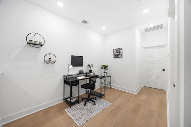 324 Neyland St, Houston, TX 77022 - office area featuring light wood-style flooring, baseboards, and recessed lighting
