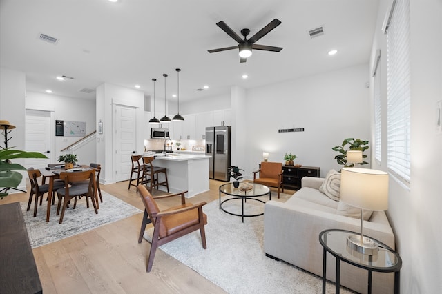 324 Neyland St, Houston, TX 77022 - living area with a ceiling fan, light wood-type flooring, and recessed lighting