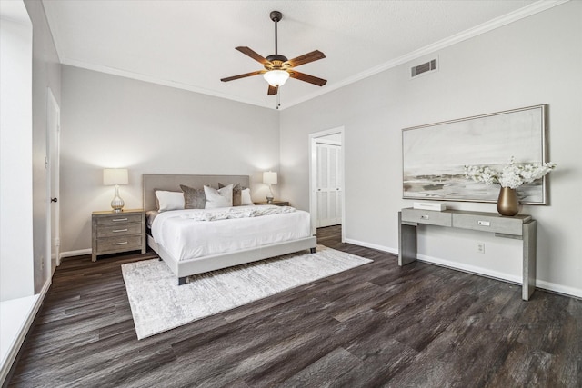 unfurnished bedroom with crown molding, dark wood-type flooring, and ceiling fan