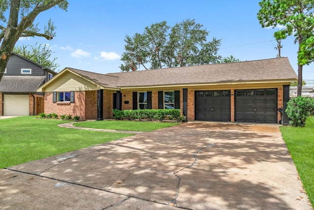 single story home with a garage and a front lawn