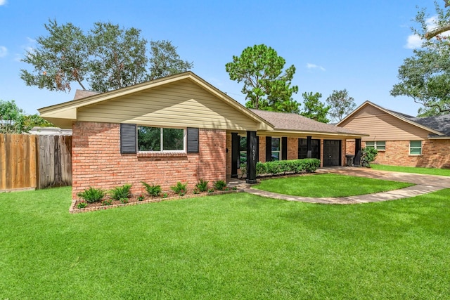 ranch-style home featuring a front yard