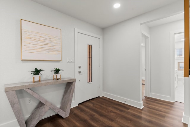 entryway with dark wood-type flooring