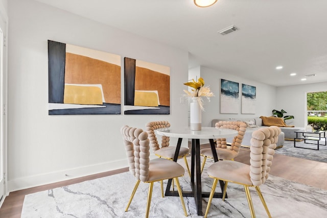 dining space featuring hardwood / wood-style flooring