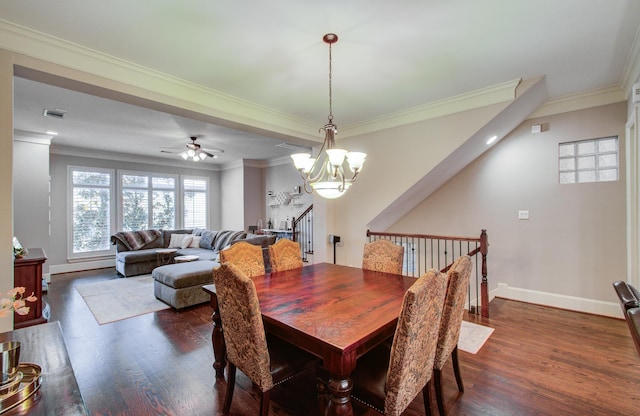 dining room with ceiling fan with notable chandelier, ornamental molding, and dark hardwood / wood-style floors