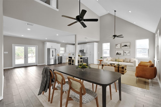 dining room with high vaulted ceiling, french doors, and ceiling fan