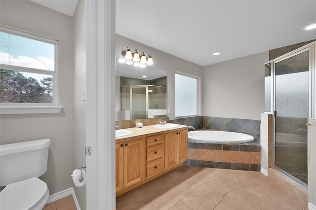 full bathroom with independent shower and bath, a healthy amount of sunlight, tile patterned flooring, and toilet