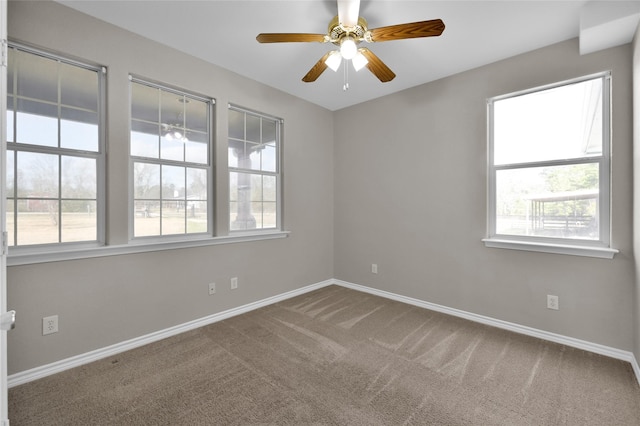 spare room with ceiling fan and carpet floors