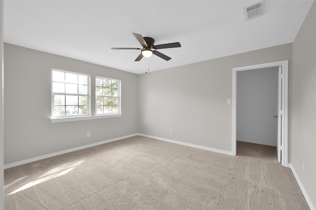 carpeted empty room with ceiling fan