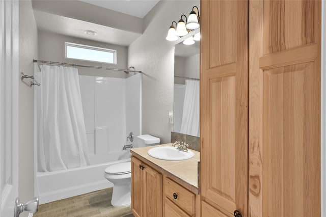 full bathroom with vanity, toilet, hardwood / wood-style floors, and shower / bath combo