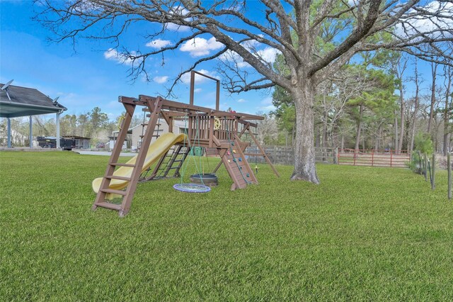 view of jungle gym featuring a lawn