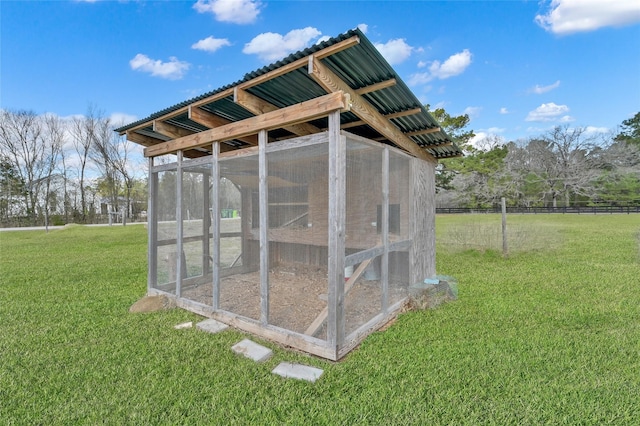 view of outdoor structure featuring a yard