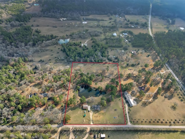 birds eye view of property with a rural view