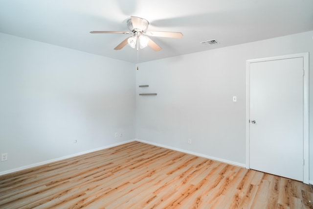 spare room with ceiling fan and light hardwood / wood-style floors