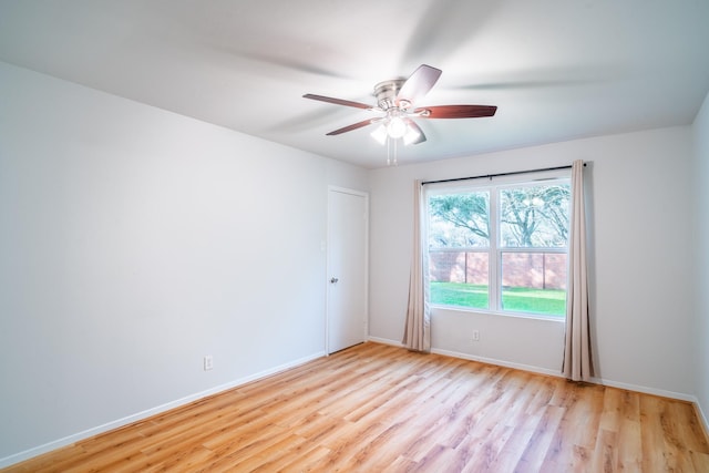 spare room with ceiling fan and light hardwood / wood-style flooring