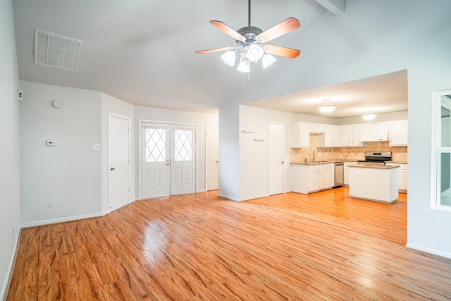 unfurnished living room with ceiling fan, light hardwood / wood-style floors, and sink