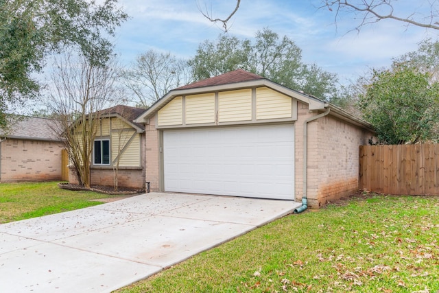 view of front of house with a garage and a front yard