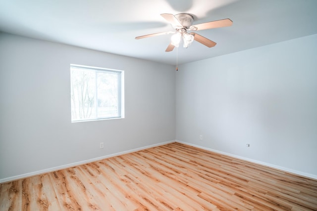 unfurnished room with ceiling fan and light hardwood / wood-style flooring