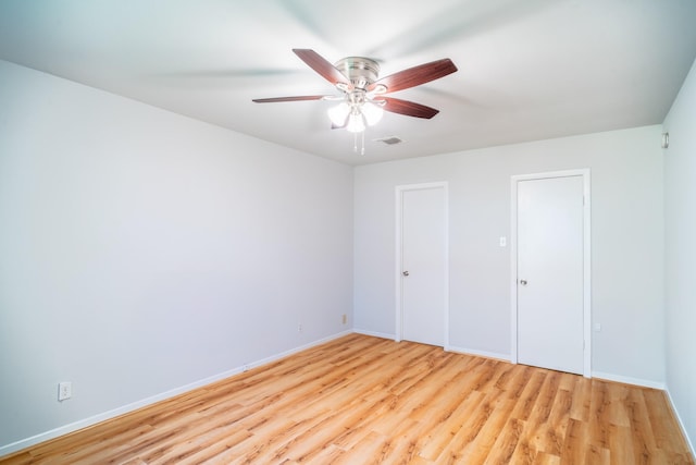 unfurnished bedroom with light hardwood / wood-style floors and ceiling fan