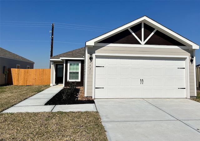 single story home featuring driveway, an attached garage, fence, and a front yard