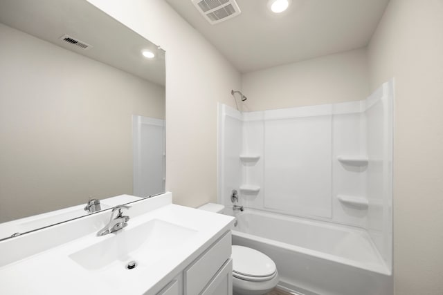 full bathroom featuring toilet, washtub / shower combination, visible vents, and vanity