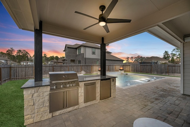 patio terrace at dusk with area for grilling, a fenced in pool, grilling area, and ceiling fan