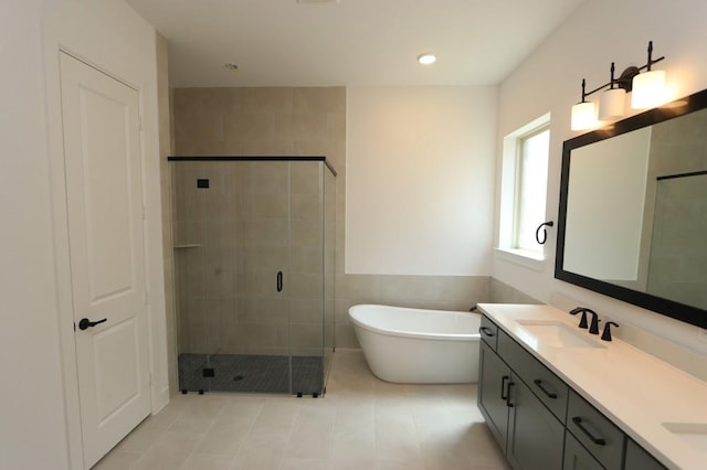 20410 Magnolia Flint Dr, Cypress, TX 77433 - full bath with a shower stall, a freestanding bath, double vanity, tile patterned floors, and tile walls