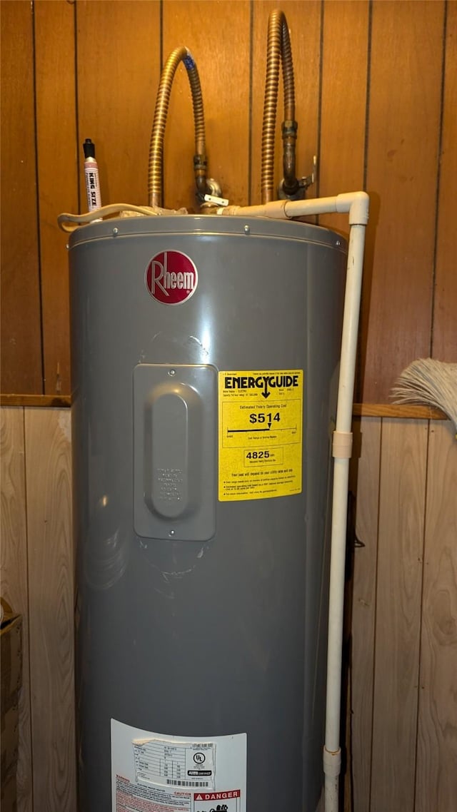 utility room featuring water heater