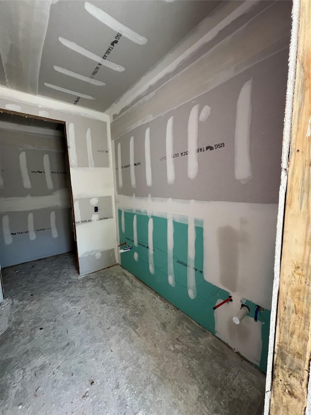 bathroom featuring concrete flooring