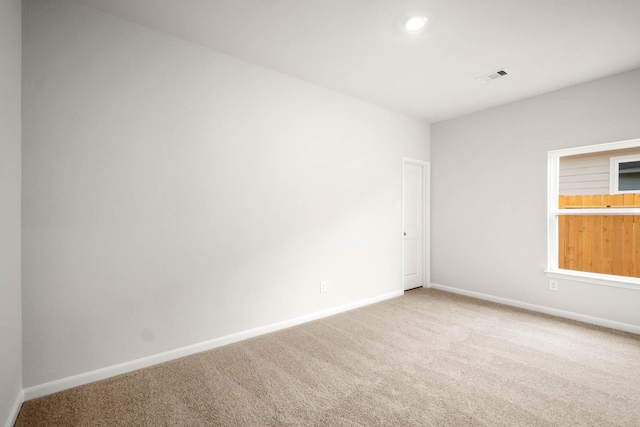 unfurnished room with carpet floors