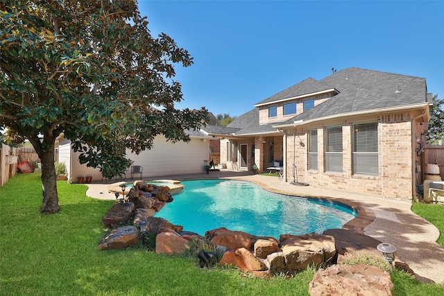 view of pool with a lawn, a patio area, a fenced backyard, and a pool with connected hot tub