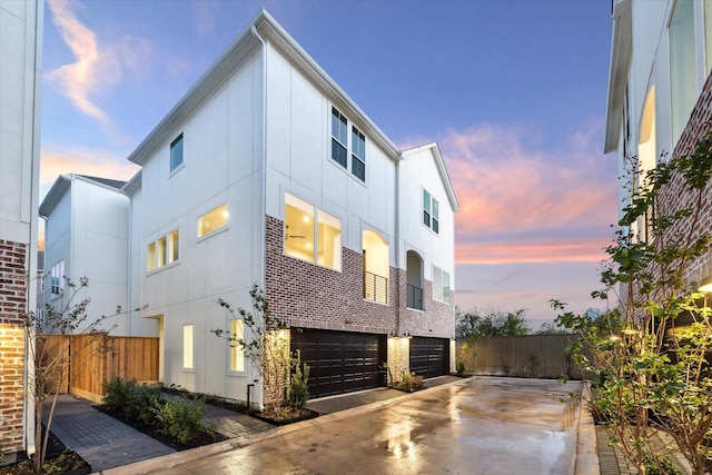 property exterior at dusk with a garage